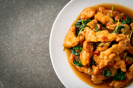 stir-fried fried fish with basil and chili in thai style - Asian food styleの写真素材