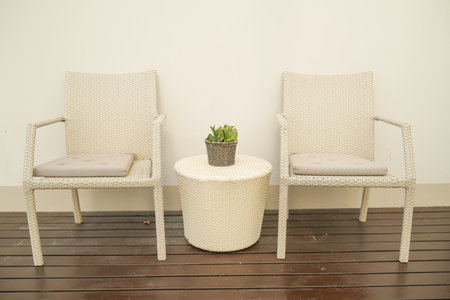 comfortable pillows decorated on wicker chairの写真素材