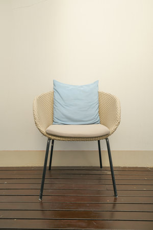 comfortable pillows decorated on wicker chair