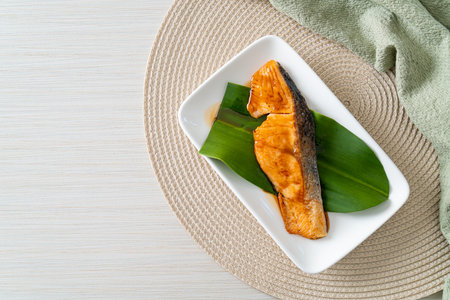 Grilled Salmon Steak with Soy Sauce on plate - Japanese food style