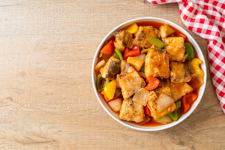 fish stew with tomato and pepper on plateの写真素材