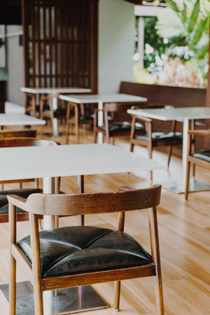 empty table and chair in restaurant - vintage effect filter