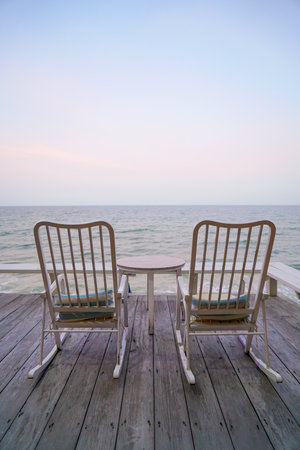 empty chair on balcony with sea background at twilight time