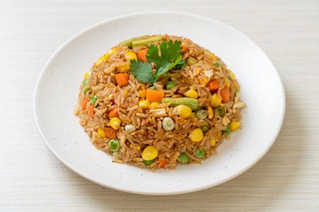 fried rice with green peas, carrot and corn - vegetarian and healthy food styleの写真素材