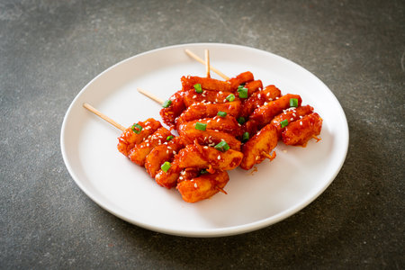 deep fried Korean rice cake (Tteokbokki) skewered with spicy sauce - Korean food styleの写真素材