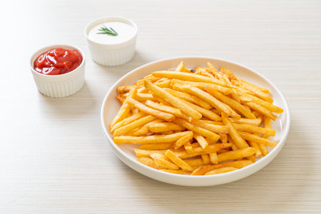 French fries or potato chips with sour cream and ketchup