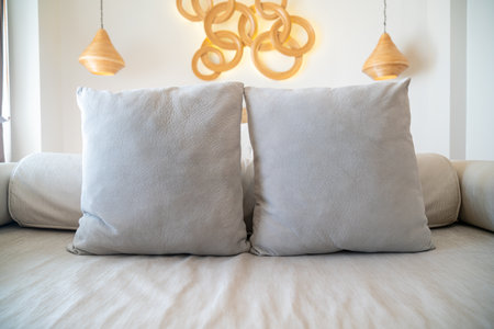 comfortable pillows on end of bed sofa decorate in bedroomの写真素材