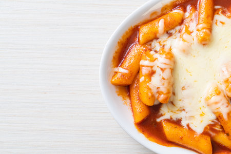 Korean rice cake in spicy Korean sauce with cheese, Cheese Tokpokki, Tteokbokki with Cheese - Korean food styleの写真素材