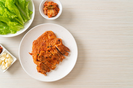 grilled pork marinated Kochujang sauce in Korean style with vegetable and kimchi - Korean food styleの写真素材