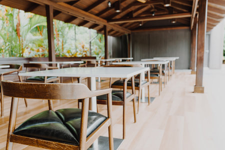 empty table and chair in restaurant - vintage effect filterの写真素材