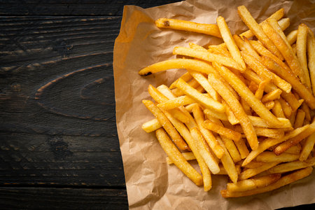 French fries or potato chips with sour cream and ketchupの写真素材