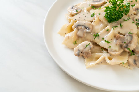 farfalle pasta with mushroom white cream sauce - Italian food styleの写真素材