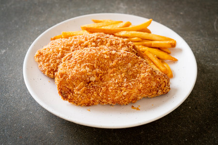 fried chicken breast fillet steak with French fries and ketchupの写真素材