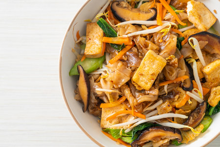 stir-fried noodles with tofu and vegetables - vegan and vegetarian food styleの写真素材
