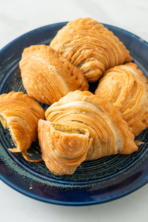 curry puff pastry stuffed chicken on plateの写真素材