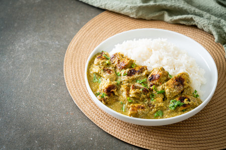 Afghani chicken in green curry or Hariyali tikka chicken hara masala with rice - Asian food styleの写真素材