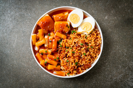 Korean instant noodles with Korean rice cake and fish cake and boiled egg - Rabokki - Korean food styleの写真素材