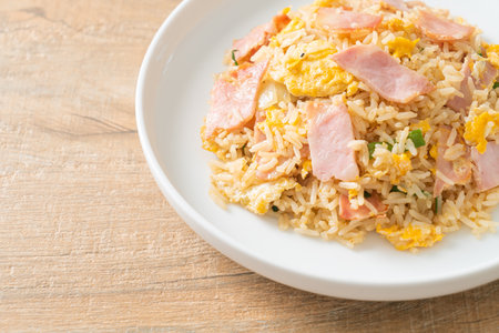 homemade bacon ham fried rice on white plateの写真素材