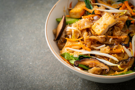 stir-fried noodles with tofu and vegetables - vegan and vegetarian food styleの写真素材