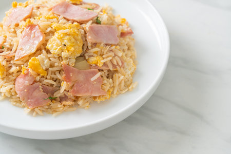 homemade bacon ham fried rice on white plateの写真素材