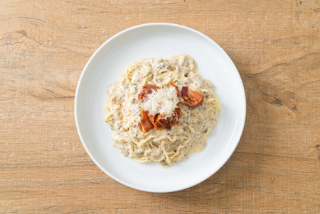 spaghetti with truffle cream sauce and mushroom on plateの写真素材