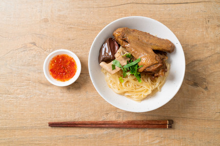 dried noodles with braised duck in white bowl - Asian food styleの写真素材