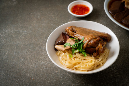 dried noodles with braised duck in white bowl - Asian food styleの写真素材