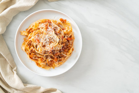 Homemade pasta fettuccine bolognese with cheese - Italian food styleの写真素材