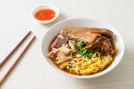 egg noodles with stewed and braised duck in brown soup - Asian food styleの写真素材