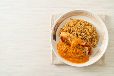 grilled chicken steak with red curry sauce and riceの写真素材
