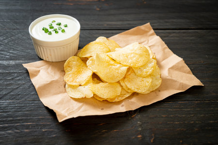potato chips with sour cream dipping sauceの写真素材