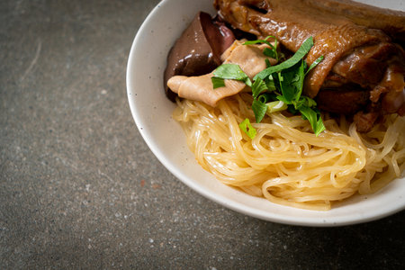 dried noodles with braised duck in white bowl - Asian food styleの写真素材