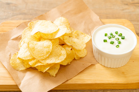 potato chips with sour cream dipping sauceの写真素材