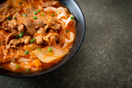 Korean udon ramen noodles with pork in kimchi soup - Asian food styleの写真素材