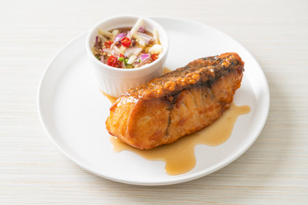 fried snapper fish with fish sauce and spicy salad - Asian food styleの写真素材