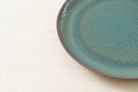empty beautiful and vintage ceramic plate with copy spaceの写真素材
