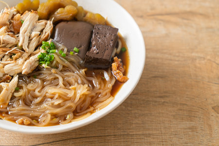 Stewed Chicken Noodle in Brown Soup Bowl - Asian food styleの写真素材