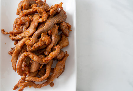 Sun-Dried Pork on white plate - Asian food styleの写真素材
