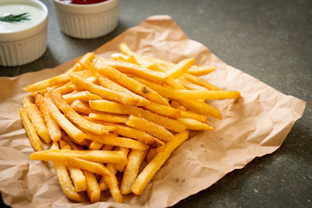 French fries or potato chips with sour cream and ketchupの写真素材
