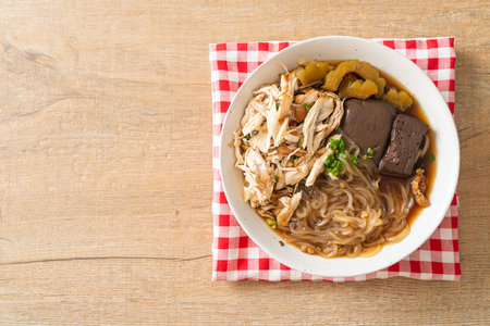 Stewed Chicken Noodle in Brown Soup Bowl - Asian food styleの写真素材