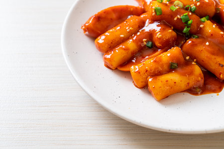 Korean rice cake stick with sausage in spicy sauce (Tteokbokki) - Korean food styleの写真素材