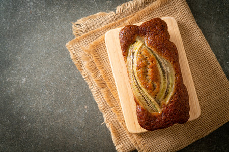 homemade banana cake on wood boardの写真素材