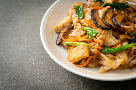stir-fried noodles with tofu and vegetables - vegan and vegetarian food styleの写真素材