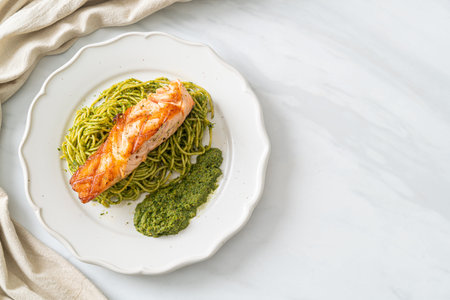 Spaghetti pesto with grilled salmon - Italian food styleの写真素材