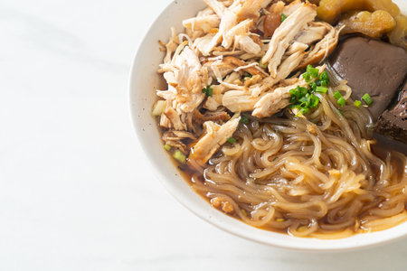 Stewed Chicken Noodle in Brown Soup Bowl - Asian food styleの写真素材