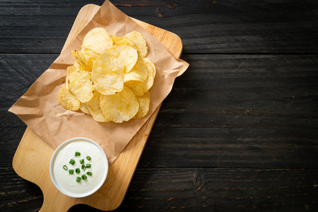 potato chips with sour cream dipping sauceの写真素材