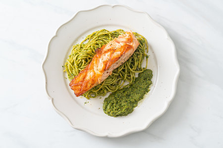 Spaghetti pesto with grilled salmon - Italian food styleの写真素材