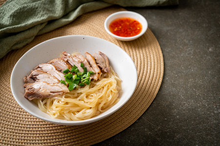 dried duck noodles in white bowlの写真素材
