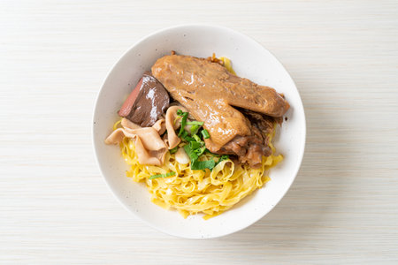 Egg noodles served dry with braised duck  - Asian food styleの写真素材