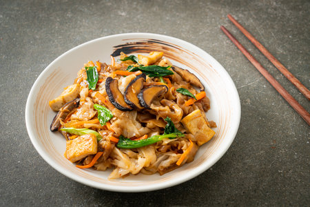 stir-fried noodles with tofu and vegetables - vegan and vegetarian food styleの写真素材